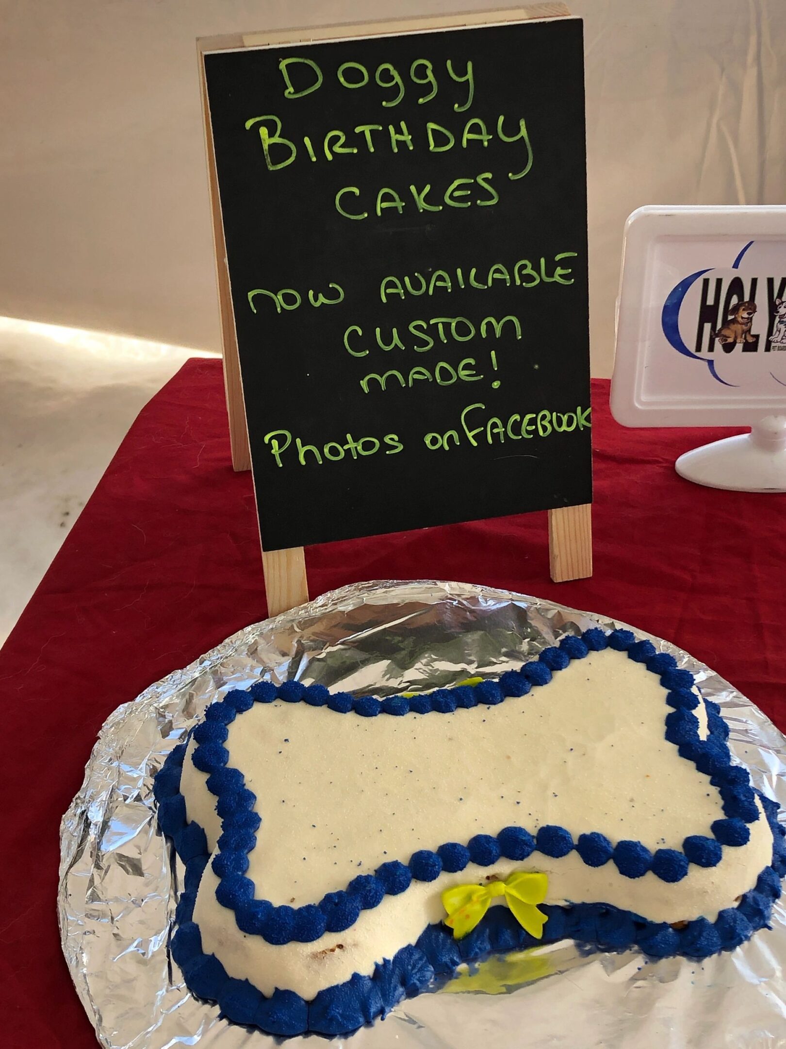 Bone-shaped cake on display table